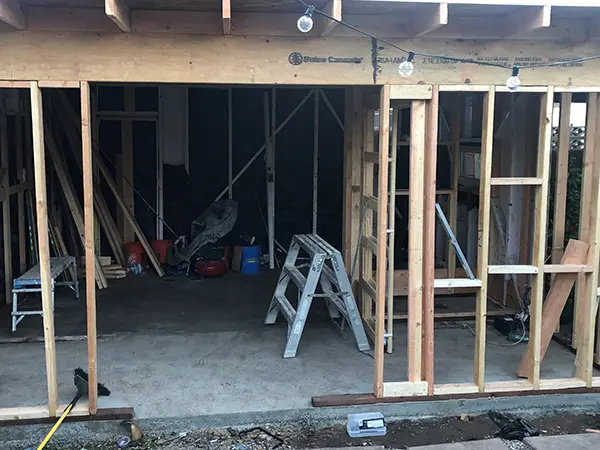 A home addition with concrete floor and wood framing